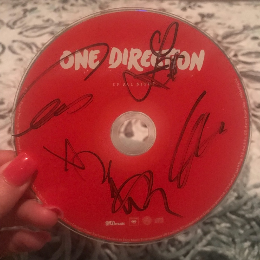 One direction cd signed by all members